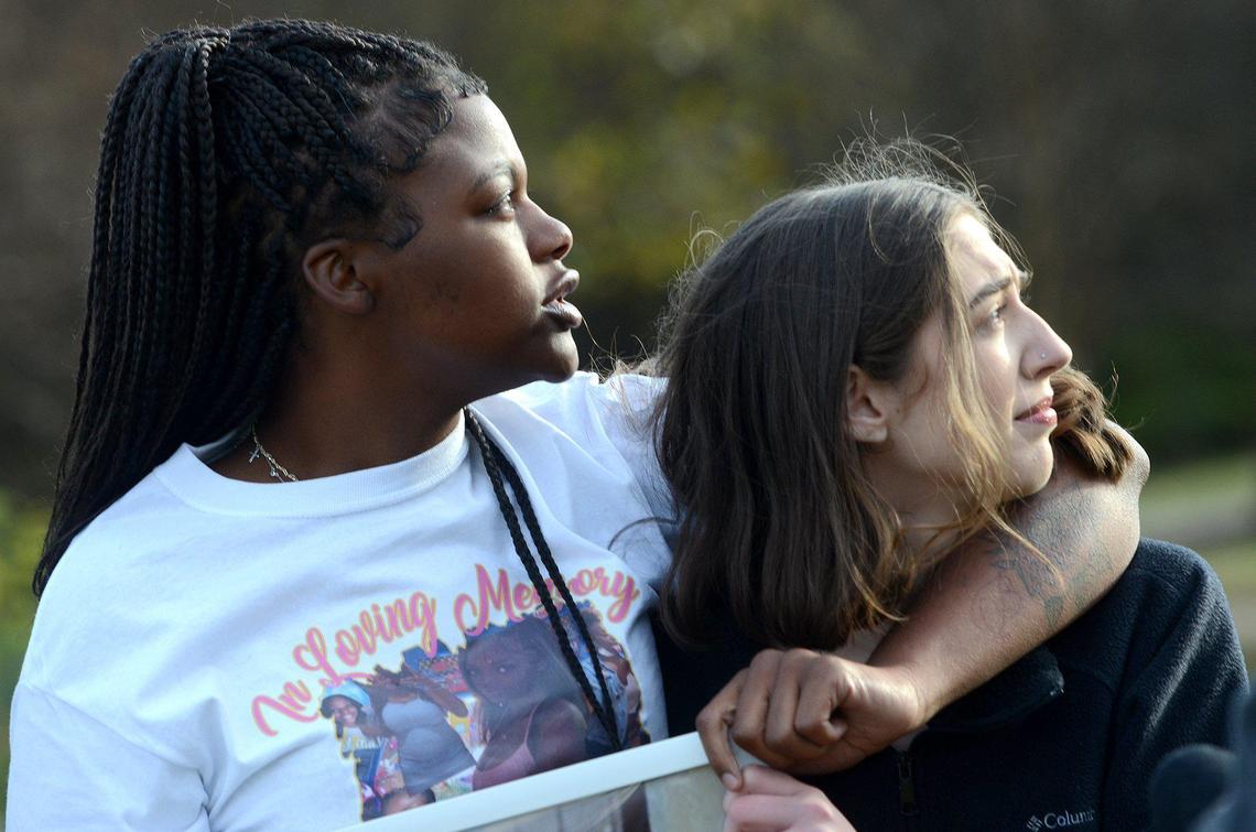 Karlotta Payton, 20 (left), younger sister of Ta’Haley Payton, and Kelanie Davis, 20, Ta’Haley’s best friend, watch the balloons from the ceremony soar over Charlotte.