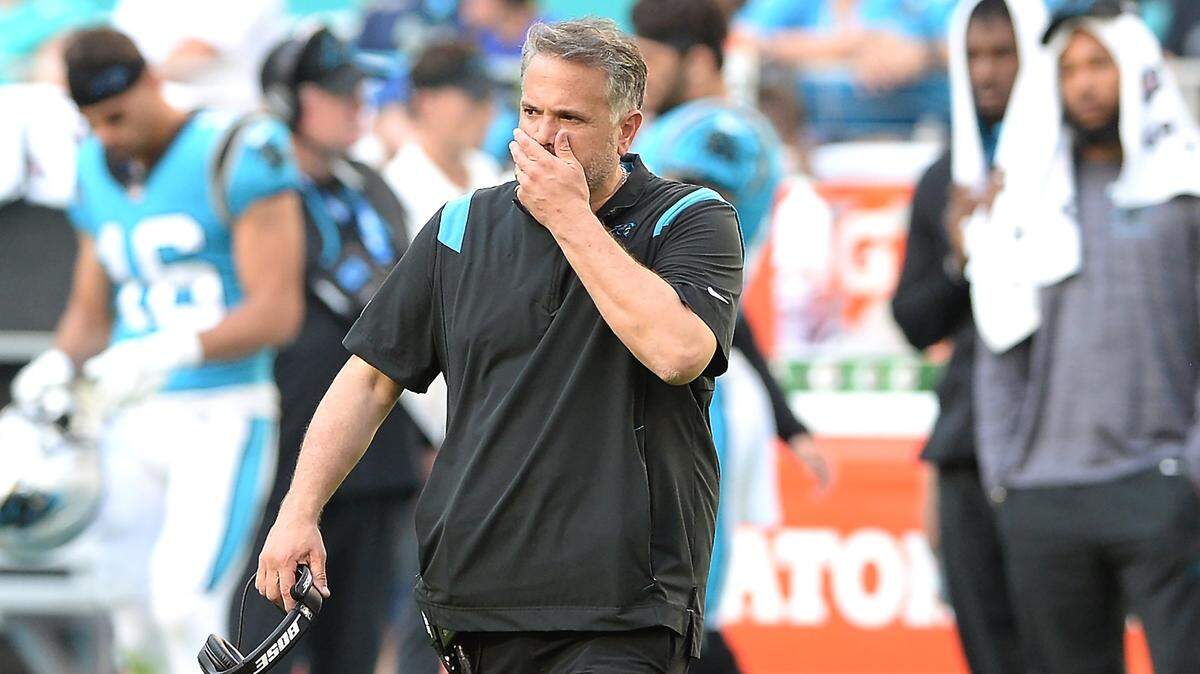 Carolina Panthers head coach Matt Rhule rubs his face as he walks across the field to check on safety Jeremy Chinn after he was injured during action against the Miami Dolphins at Hard Rock Stadium in Miami Gardens, Fla. on Sunday, November 28, 2021. The Dolphins defeated the Panthers 33-10.