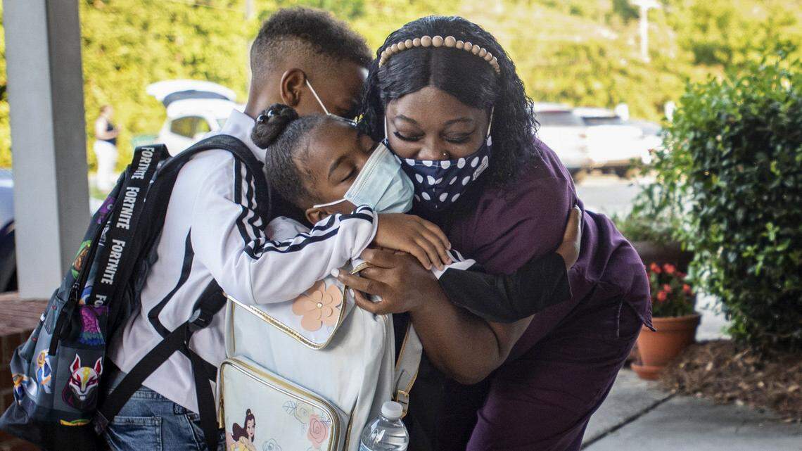 ‘Mixed emotions,’ mostly smiles behind masks on CMS first day. Here’s what it looked like.