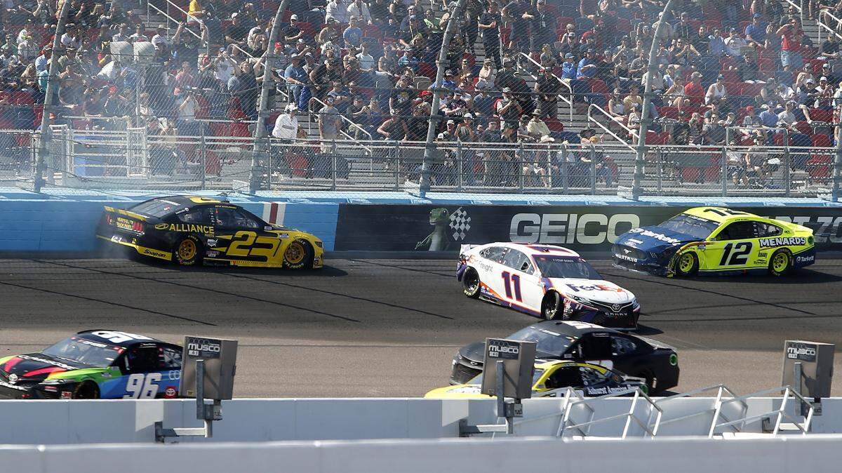 Brad Keselowski (2) and Denny Hamlin (11) and Ryan Blaney (12) crash during lap 65 of a NASCAR Cup Series auto race at Phoenix Raceway, Sunday, March 8, 2020, in Avondale, Ariz. (AP Photo/Ralph Freso)
