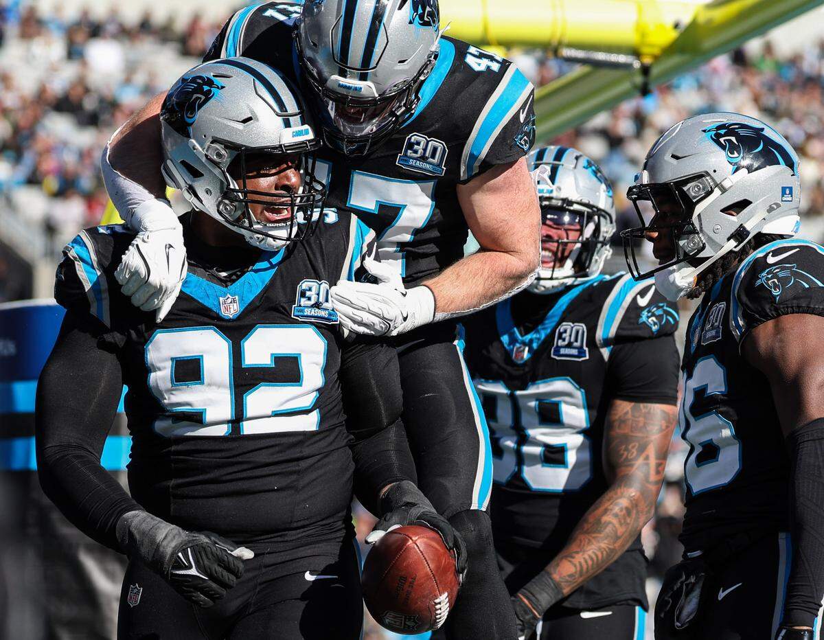 Panthers defensive tackle Jonathan Harris (92) celebrates recovering the Cardinals’ fumbled ball during the game at Bank of America Stadium in Charlotte, NC on Sunday, December 22, 2024.