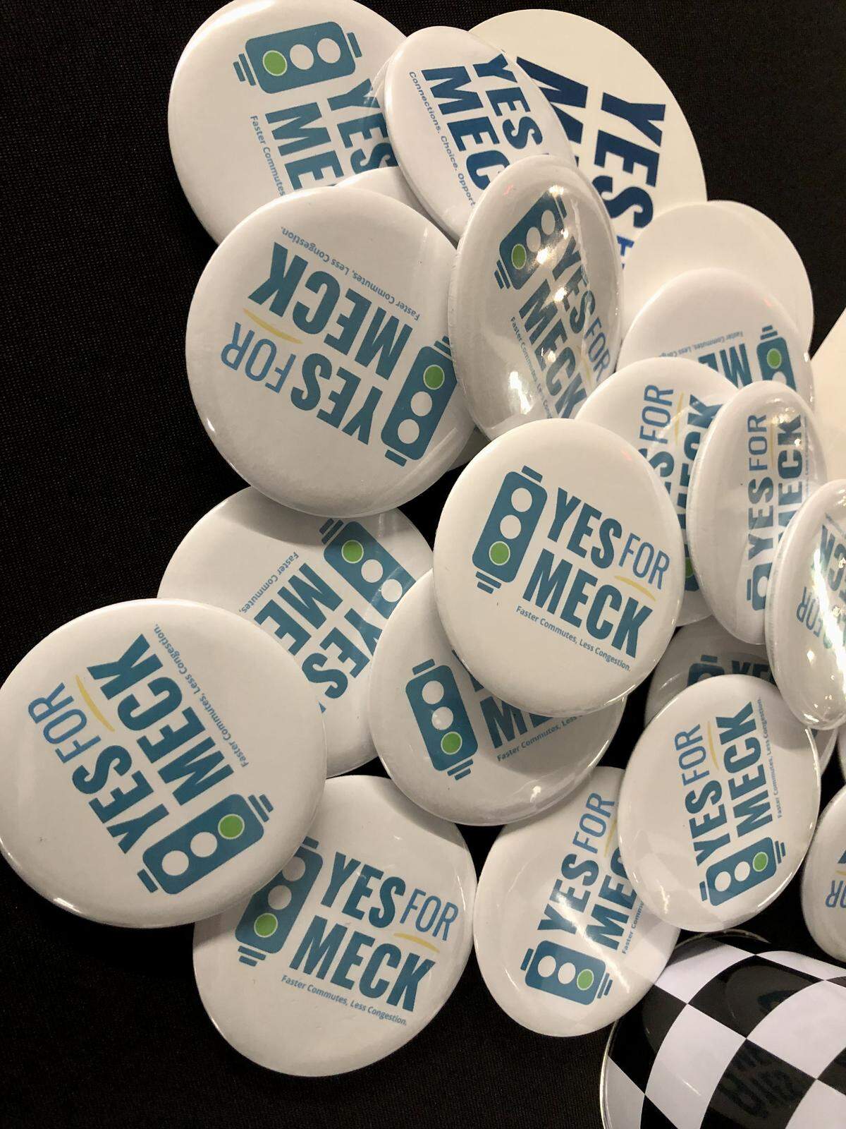 Yes for Meck buttons await supporters of a 1% transportation referendum.