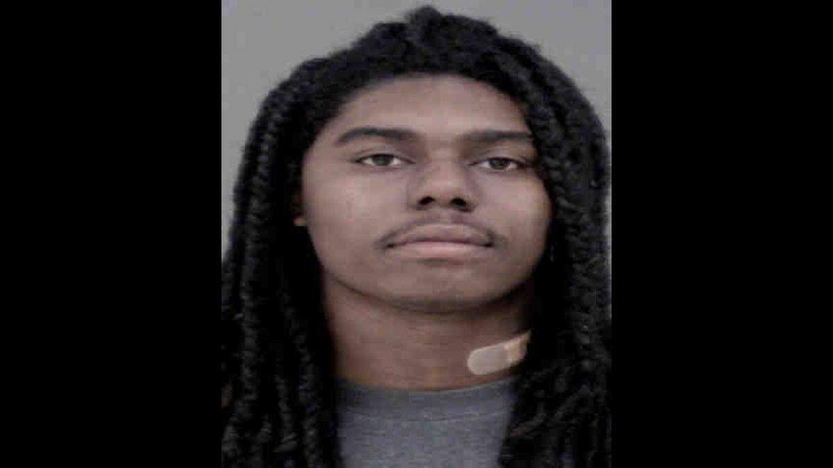 Davione Marquis Robinson faces charges after a bullet from a gun a toddler found grazed a 3-year-old and a 19-year-old in a north Charlotte hotel room, police said.