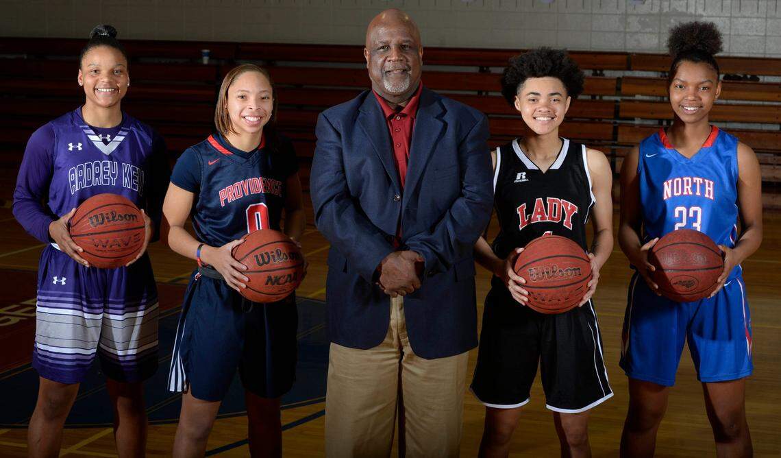 The All-Mecklenburg girls basketball team: Deniyah Lutz, Ardrey Kell , Kennedy Boyd, Providence Day, Coach Clarence Johnson, Mallard Creek, Jordan McLaughlin, Berry, and Jessica Timmons, North Mecklenburg. Photographed at Providence Day on Thursday, March 22, 2018.