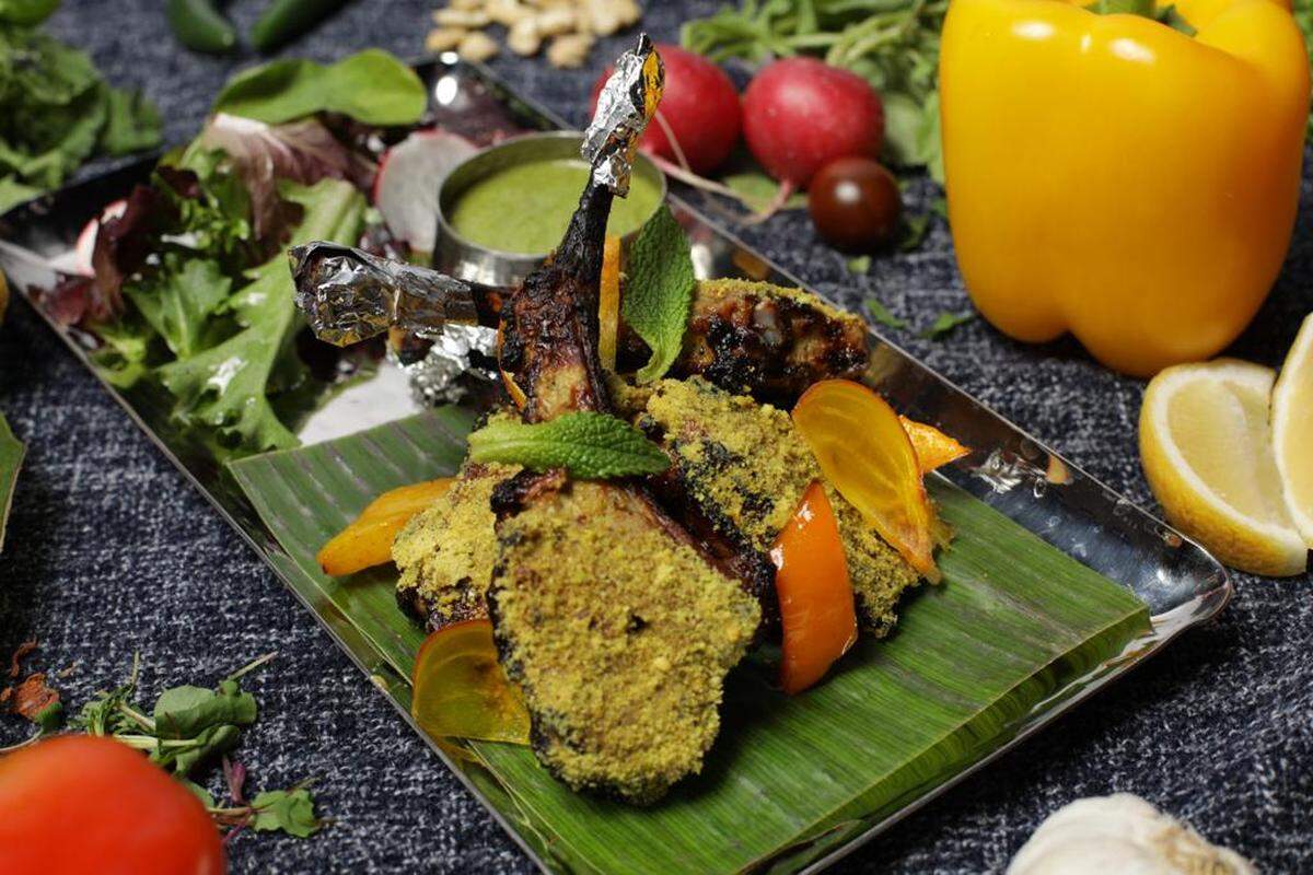 Exotica Indian Kitchen & Bar in uptown Charlotte focuses on traditional tastes of India including Tandoori lamb chops, lamb chops marinated in yogurt, vinegar and spices chargrilled in a Tandoor.