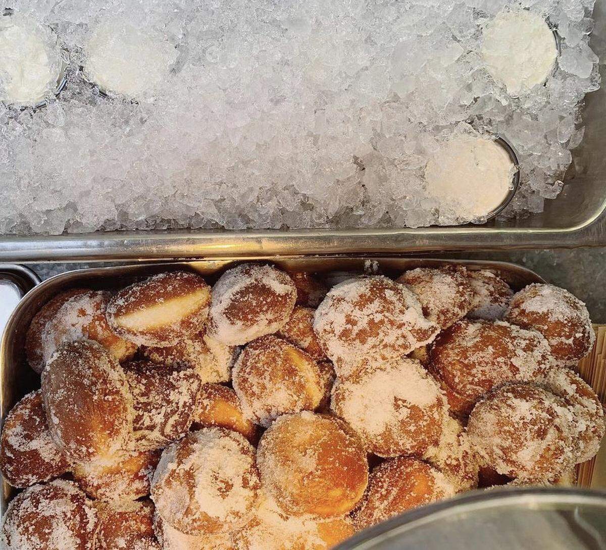 On National Doughnut Day, get 4 brioche doughnut holes with a side of diplomat cream for $6 at Coco & The Director.