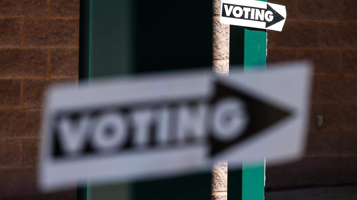 Directional signs point voters to the entrance of the polling location at North Ridge Middle School during the primary election in Charlotte, NC on Tuesday, September 9, 2025.