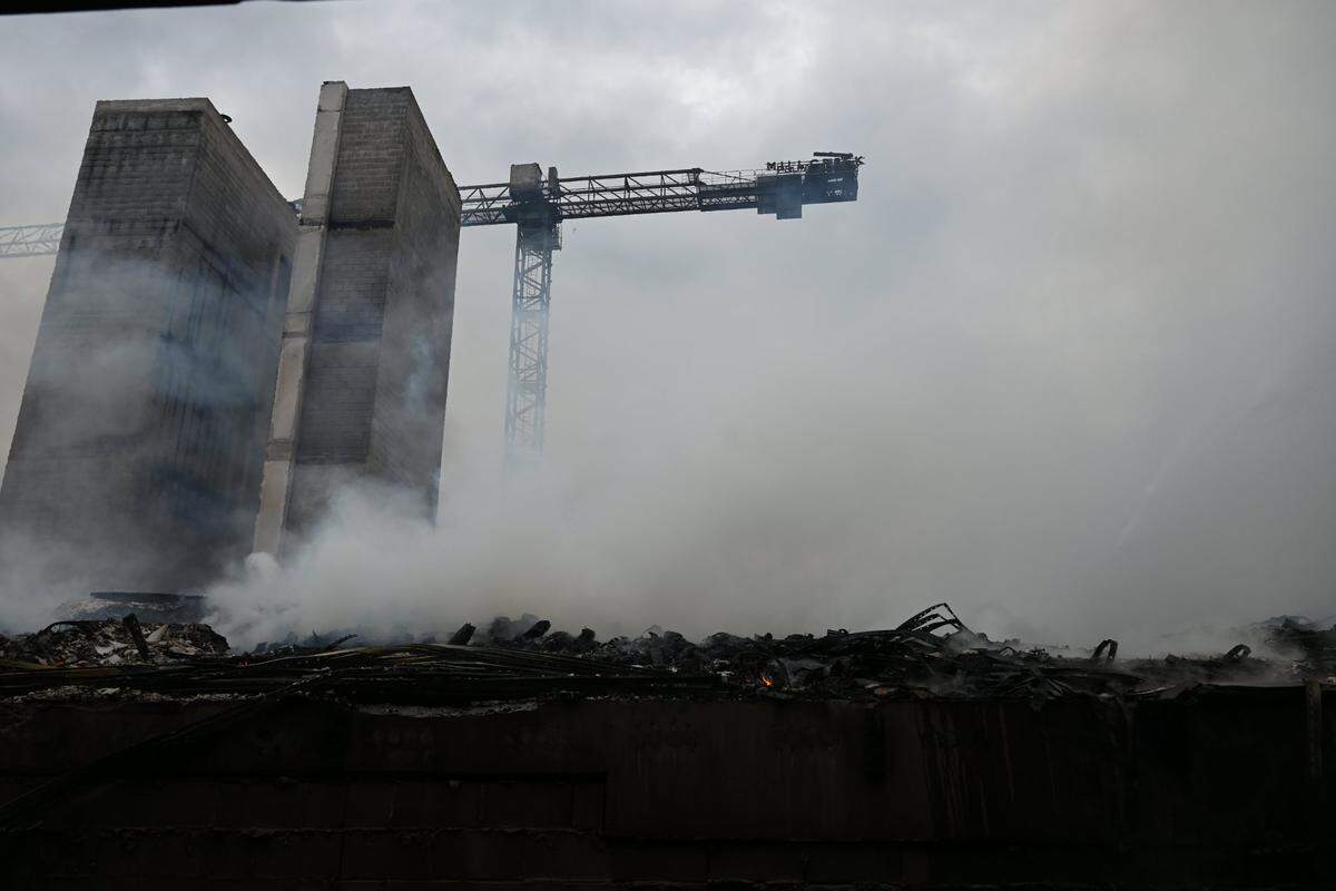 A crane and two elevators structures remain after a massive fire spread across at least two structures and threatened others in Charlotte’s South Park neighborhood Thursday morning, May 18, 2023