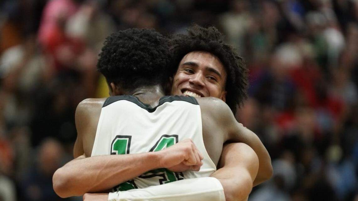 Myers Park point guard Bishop Boswell embraces wing Sir Mohammed after the Mustangs beat North Meck in the NC 4A Western Regional final Saturday
