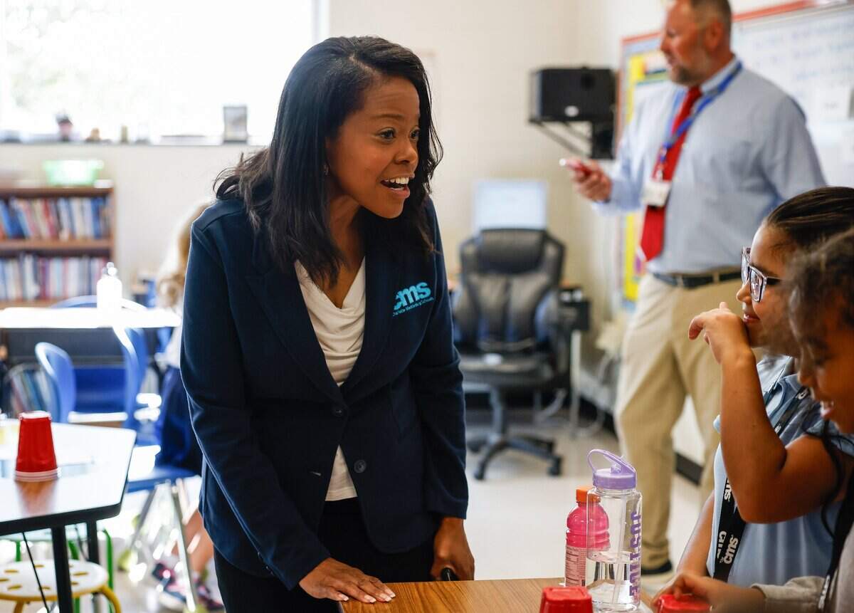 CMS Superintendent Dr. Crystal Hill speaks with third grade students during the first day of school at Idlewild Elementary School in Charlotte, NC on Monday, August 26, 2024.