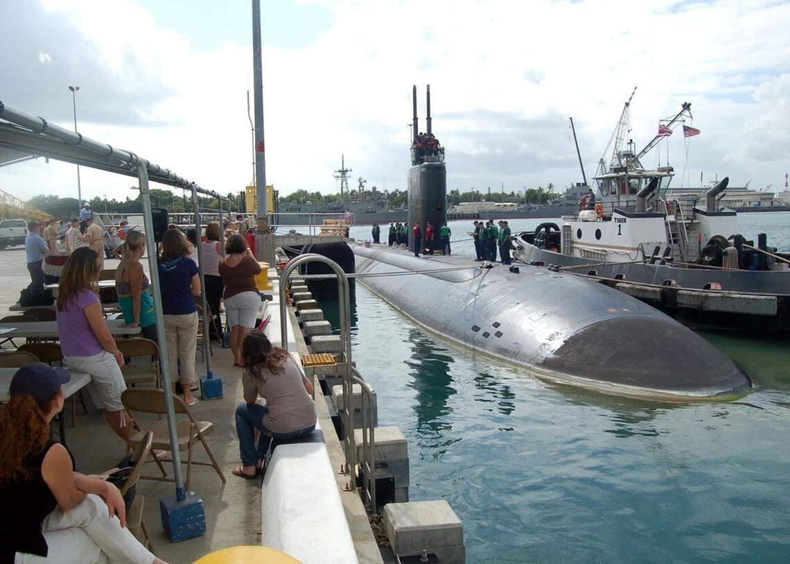 Family and friends gather on the pier at Naval Station Pearl Harbor as the Los Angeles-class attack submarine USS Charlotte (SSN 766) departs for a six-month deployment to the western Pacific.