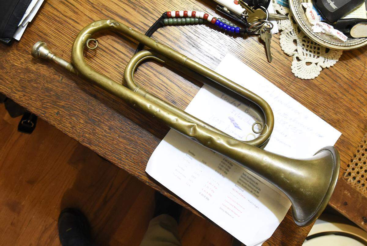 Don Woodside,77, played Taps on this particular bugle for the first time at his Matthews home Wednesday evening. It was the bugle in the Japanese POW camp where his uncle Milton Woodside was held in WWII.