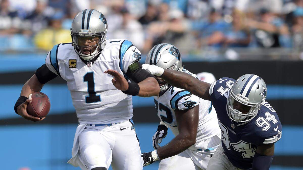 While Carolina’s Cam Newton (1) was effective running the ball against Dallas, he also didn’t complete a pass longer than 19 yards. The game plan for Atlanta: Run Newton less and the tailbacks more while also trying for more explosive plays in the passing game.