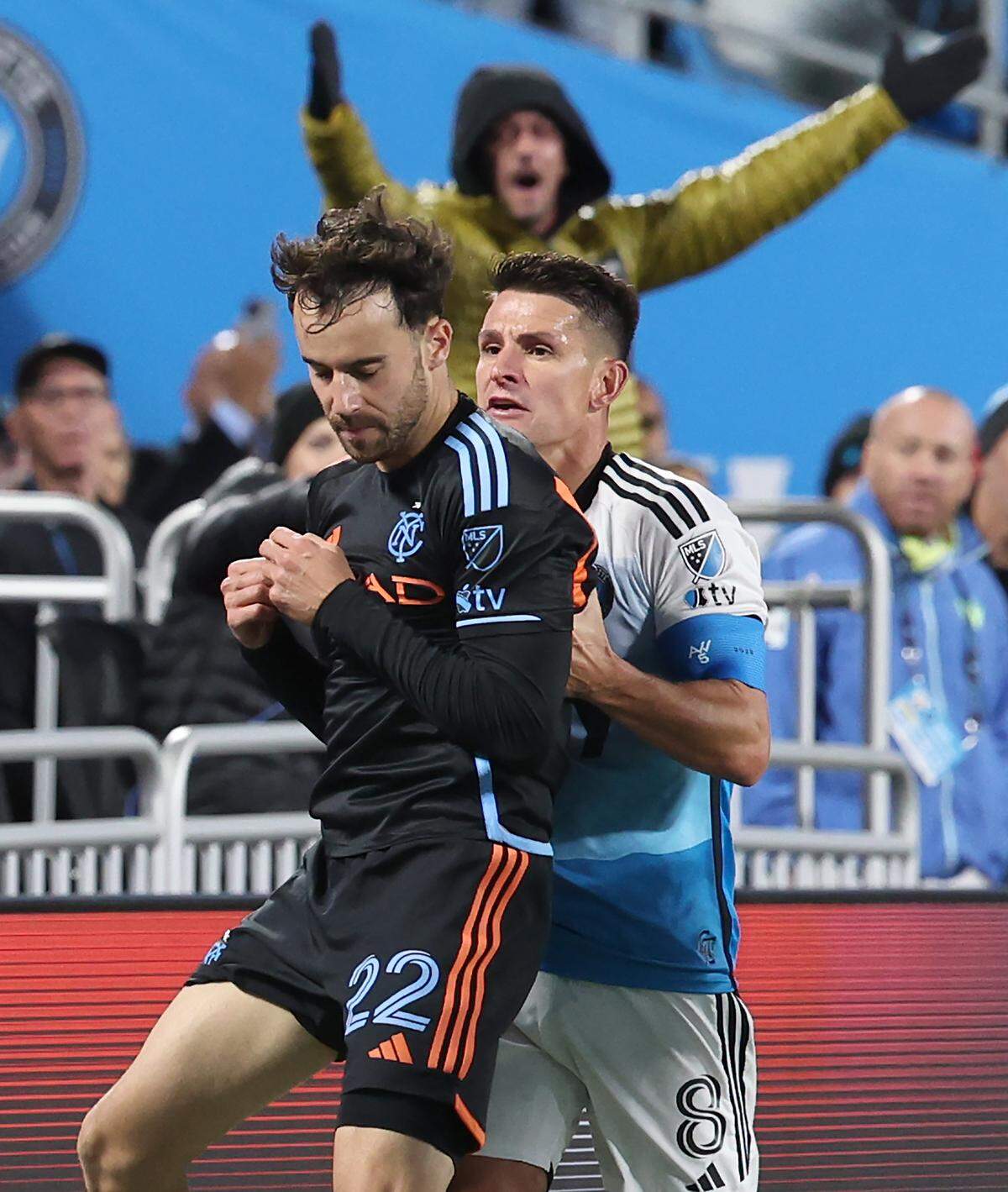 Charlotte FC central midfielder Ashley Westwood, right, pushes New York City FC left wing back Kevin O’Toole, left, after Westwood was pushed out of bounds during action on Tuesday night in Charlotte. 