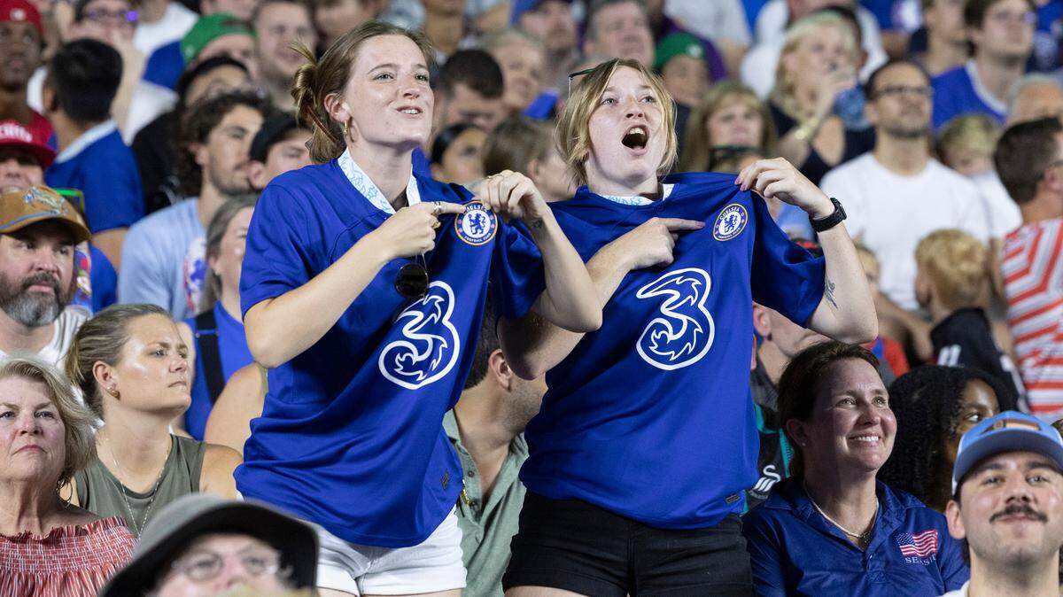 Sarah Stephen, left, from Charlotte, and Jordynne Godsey of McDonough, Georgia celebrate after Chelsea scored during the first half of Chelsea Football Club’s friendly match against Wrexham AFC at Kenan Stadium in Chapel Hill, N.C., Wednesday, July 19, 2023. The two came just to see the game.