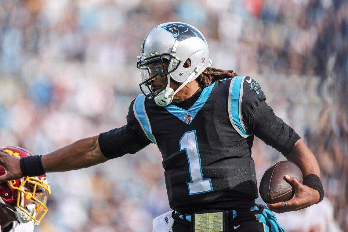 Carolina Panther quarterback Cam Newton rushes for a 24-yard touchdown against the Washington Football Team at Bank of America Stadium Sunday.