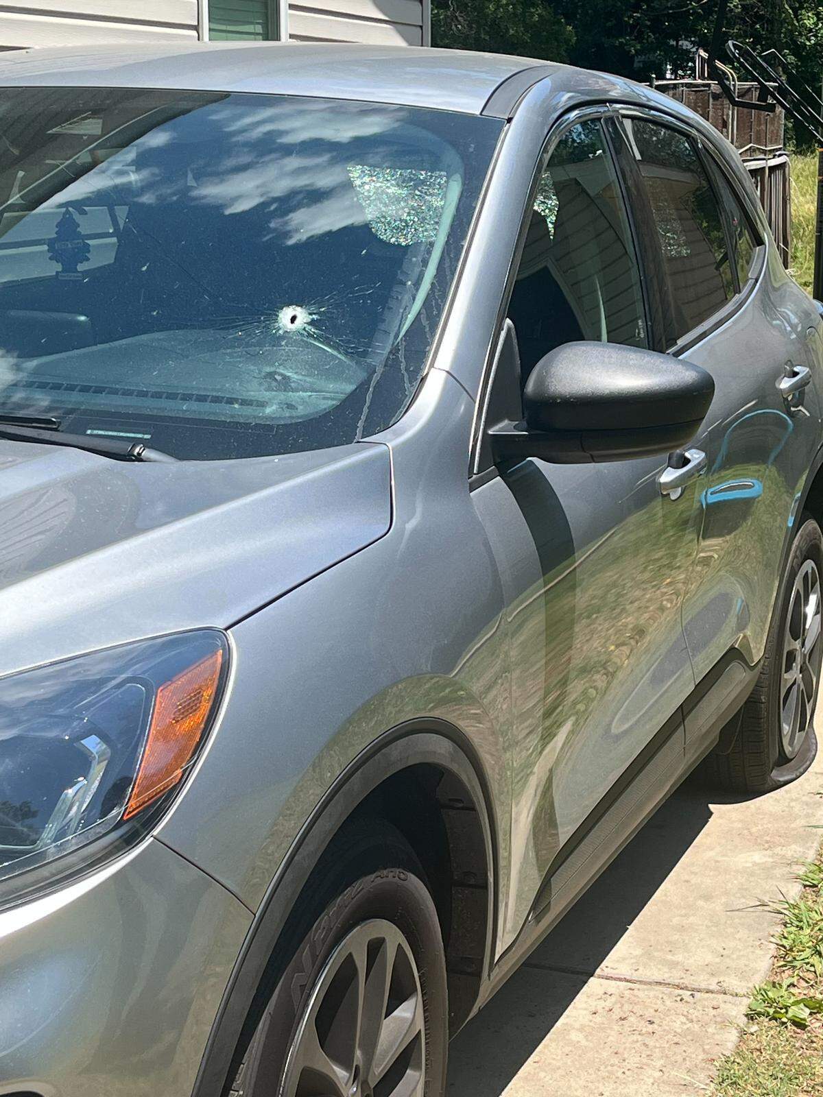 A man who Gastonia police say barricaded himself inside a home Wednesday morning fired rounds at a car across the street.