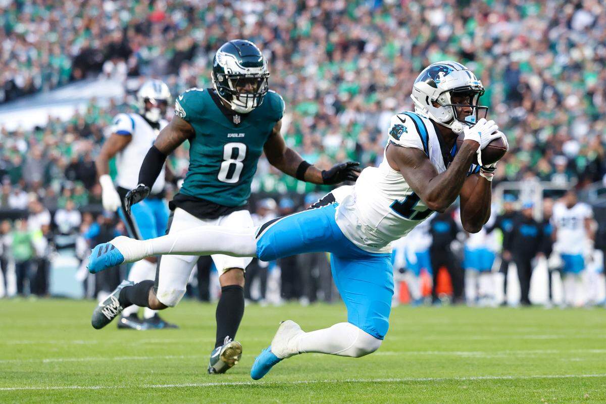 Dec 8, 2024; Philadelphia, Pennsylvania, USA; Carolina Panthers wide receiver Xavier Legette (17) is unable to catch a long pass in front of Philadelphia Eagles safety C.J. Gardner-Johnson (8) in the final minute of the game at Lincoln Financial Field. Mandatory Credit: Bill Streicher-Imagn Images