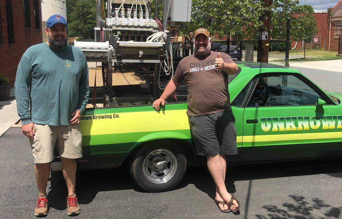 Triple C Brewing Co. founder Chris Harker lent the brewery’s bottling line to Brad Shell of The Unknown Brewing Co. so it could package its hand sanitizer.