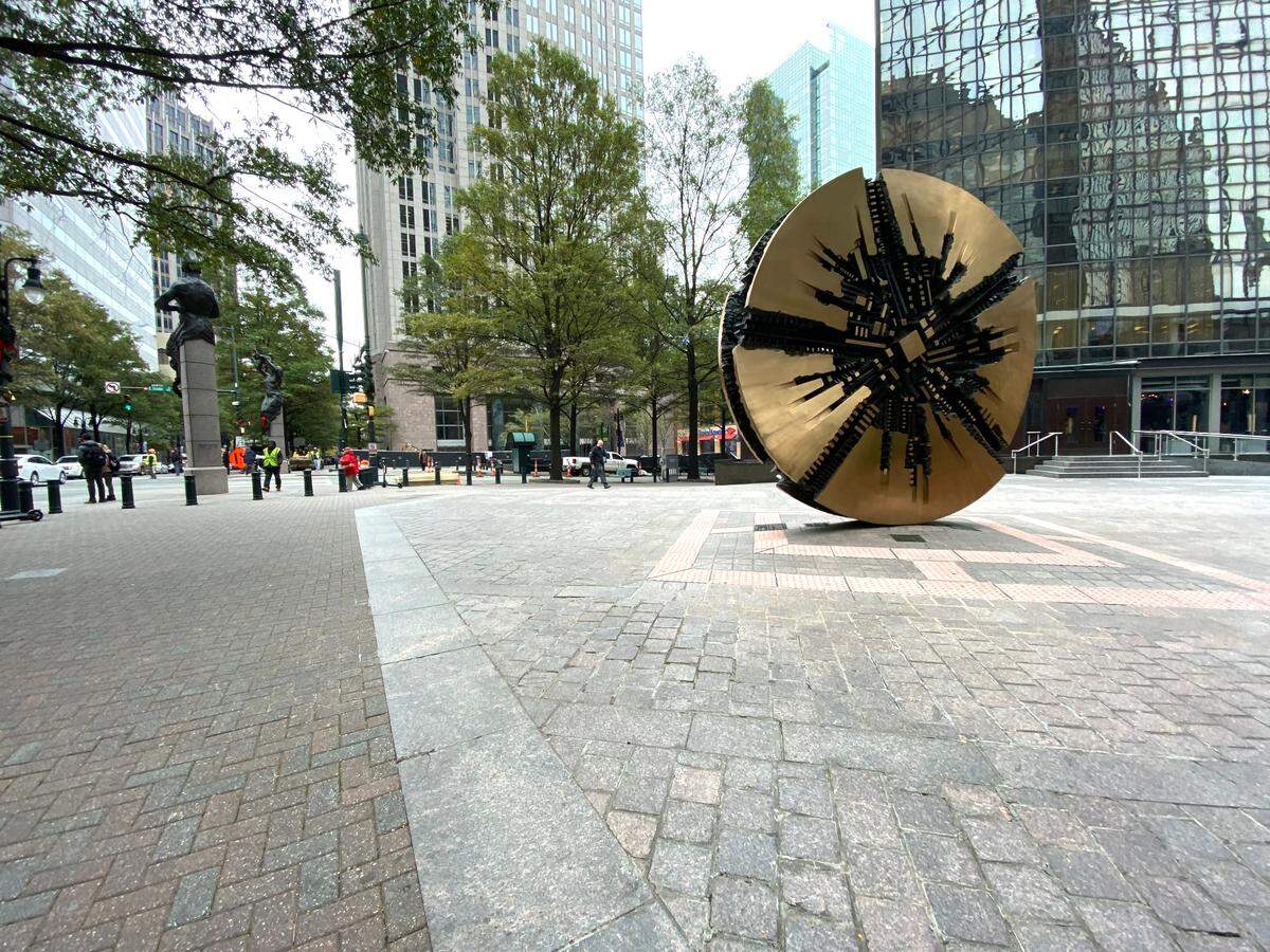 “Il Grande Disco” at Trade and Tryon Streets by Arnaldo Pomodoro, 1974.