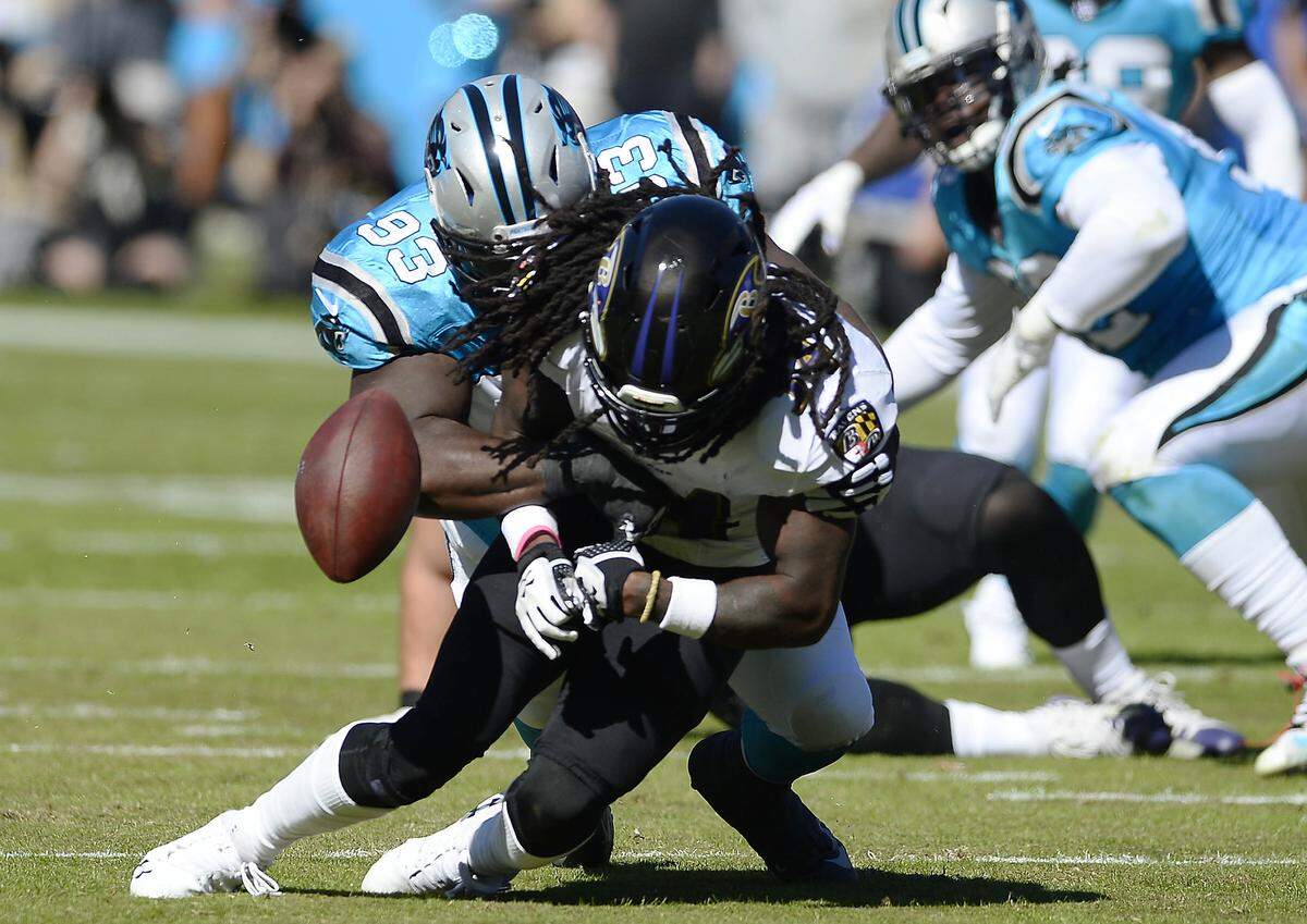 Carolina Panthers defensive tackle Kyle Love (93) knocks the ball from Baltimore Ravens running back Alex Collins (34). Love had a stellar season and should be a priority for a team-friendly deal in 2019.