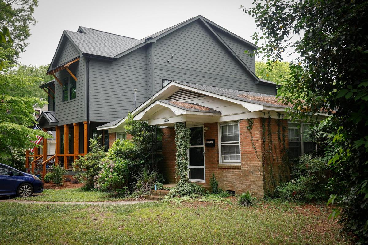 A home on Bay Street in Chantilly towers over one of the older, low-slung homes.