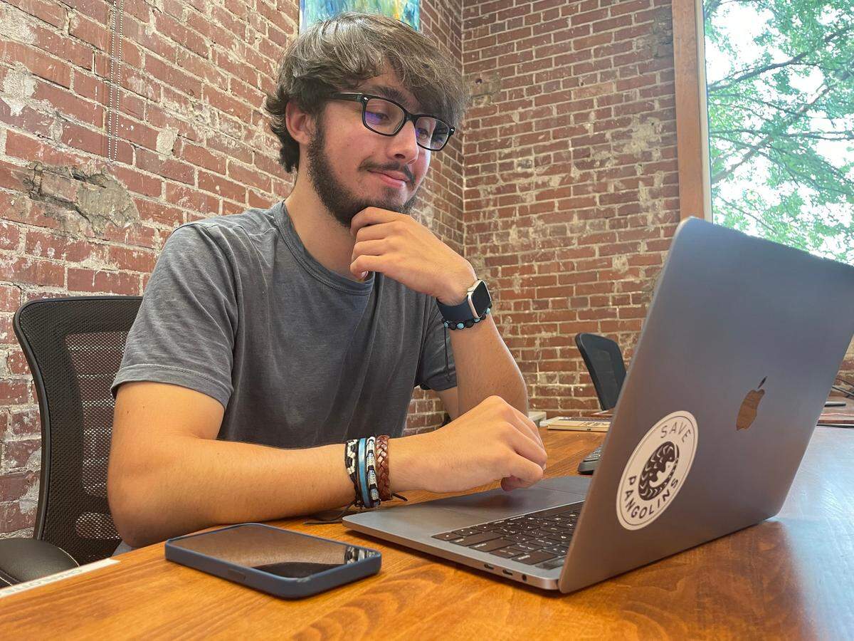 The Charlotte Observer’s business intern Gabe Castro-Root and member of Gen Z works on projects for the publication.