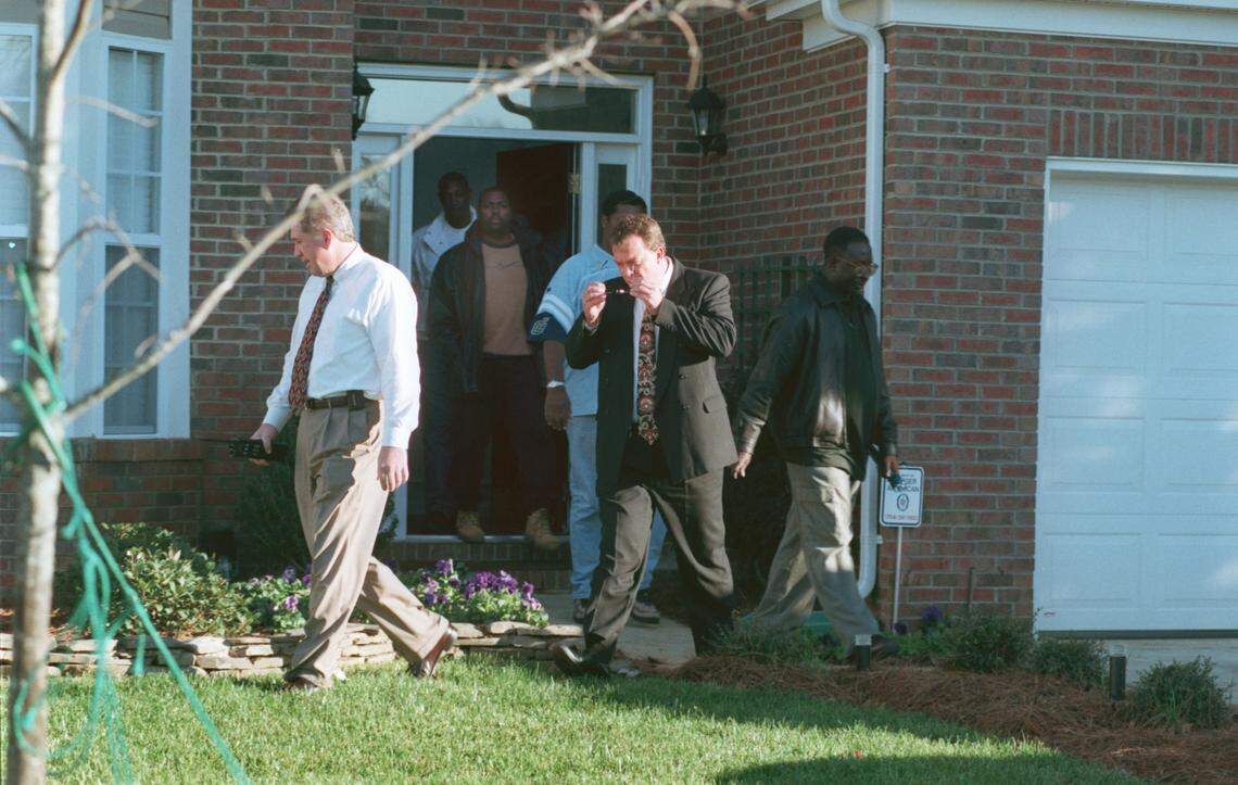 12/14/99 Men leave the house of Rae Carruth Tuesday afternoon. Nearly a month after being shot, Carruth’s girlfriend Cherica Adams died from her wounds. Police said warrants have been issued charging Carruth with first-degree murder. STEPHANIE GRACE LIM/STAFF