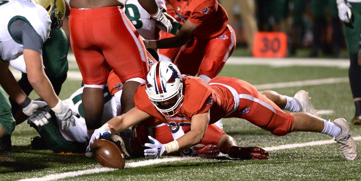 Providence Day Chargers defensive end Harrison Barnett, recovers a Rabun Gap fumble during first quarter action at Providence Day School in Charlotte, NC on Friday, November 19, 2021. The Chargers hosted Rabun Gap in the NCISAA boys state championship game.