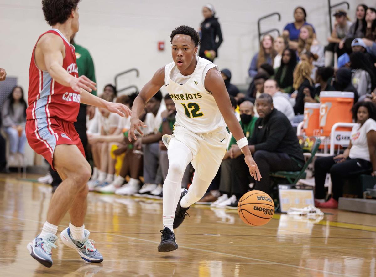 Patriot’s Kaleb Jasper (12) brings the ball into the backcourt. The Patriot Men’s basketball team would host the Charlotte Catholic Cougars December 12, 2023.
