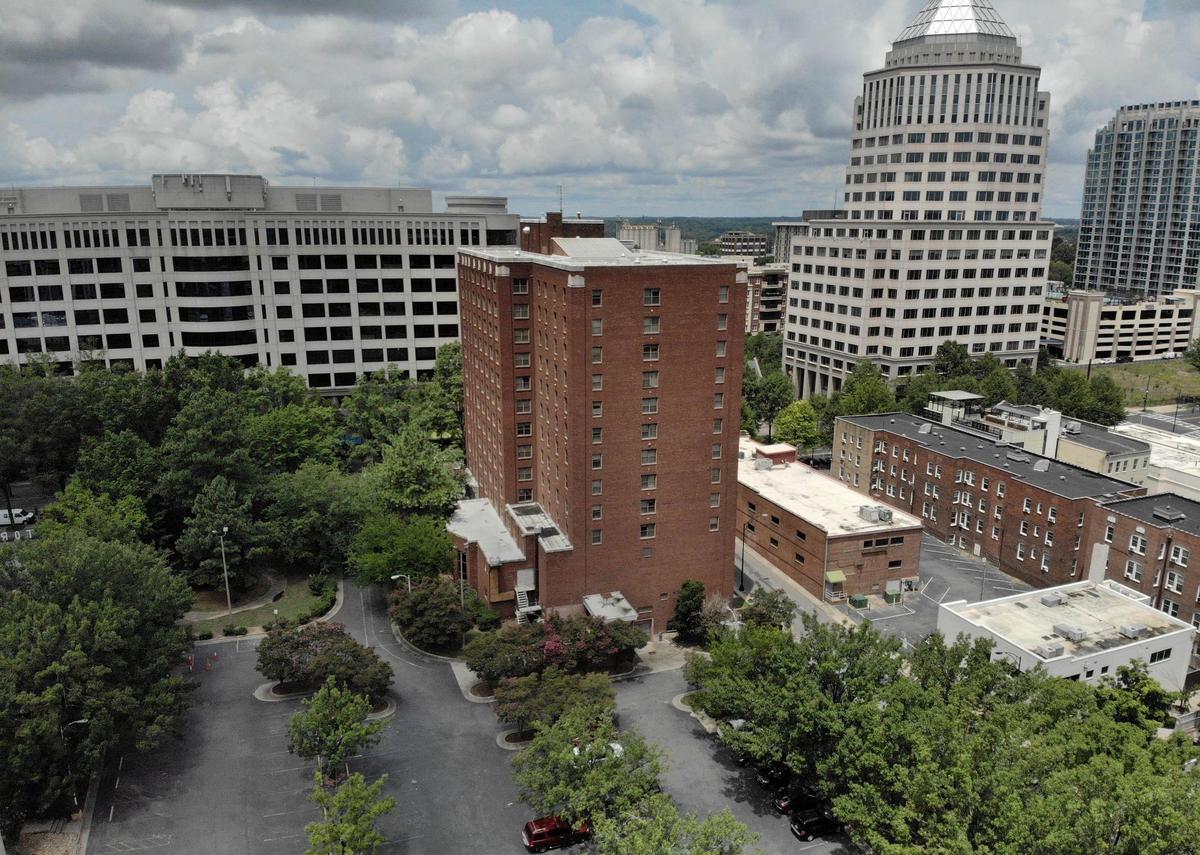 Hall House, center, is pictured in 2020 along N. Tryon Street and E. Eighth Street. The building, which opened in 1940 as the Barringer Hotel, has since been demolished. Inlivian, formerly the Charlotte Housing Authority, plans to build nearly 400 apartments on land it owns in uptown.