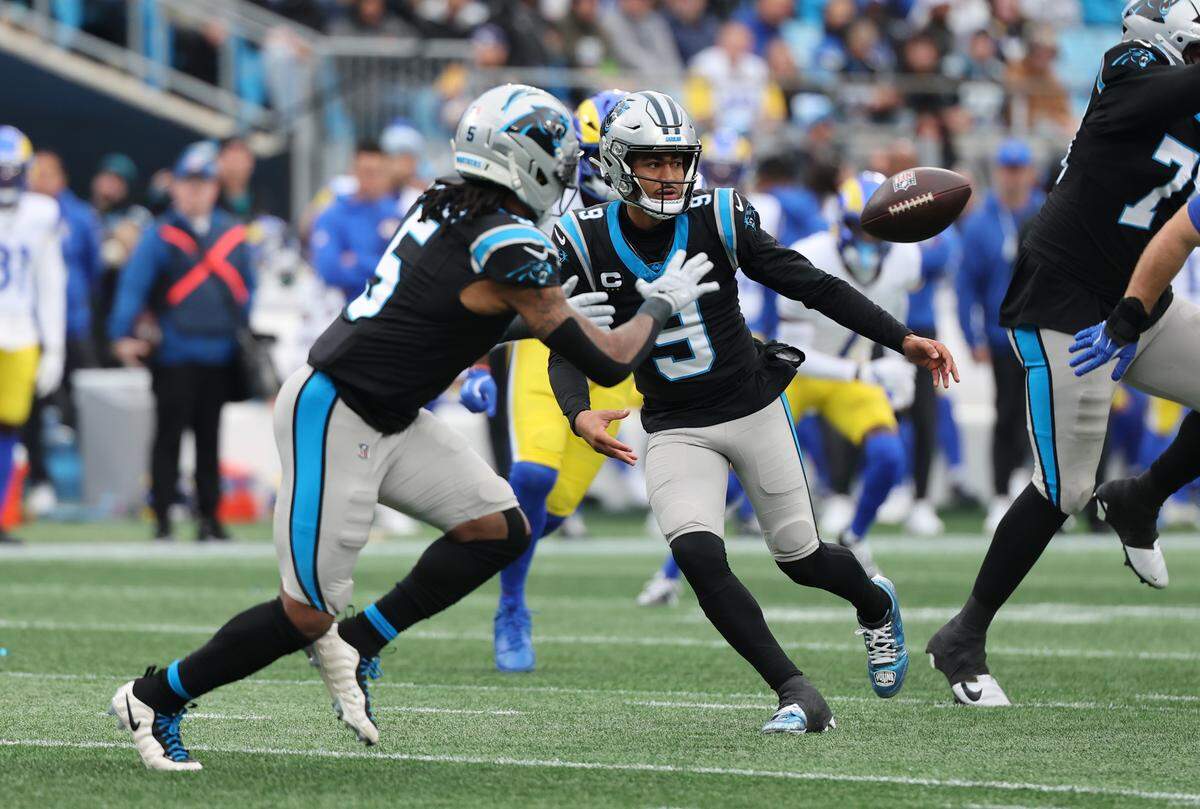 Carolina Panthers' Rico Dowdle waits for the pass from Bryce Young Sunday, Nov. 30, 2025 at Bank of America Stadium in Charlotte.