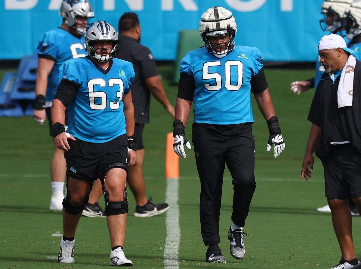 Panthers guard Robert Hunt (50) walks to a drill during training camp practice in Charlotte, NC on Monday, July 29, 2024.