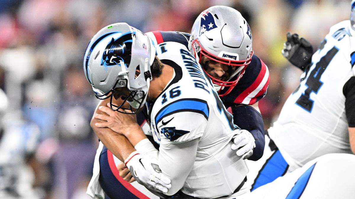 Carolina Panthers quarterback Jack Plummer (16) is sacked by New England Patriots linebacker Christian Elliss (53) during Thursday’s first half at Gillette Stadium. The Panthers lost 17-3, playing their reserves and ending up with more punts (10) than first downs (7).