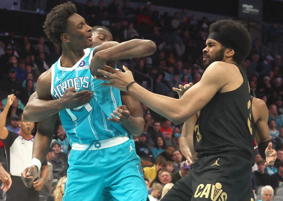 Charlotte Hornets forward/center Moussa Diabate, left, turns to confront Cleveland Cavaliers center Jarrett Allen after Allen held onto Diabate’s arm on a shot in the lane during action at Spectrum Center in Charlotte, North Carolina, on Wednesday, Jan. 21, 2026. The Cavaliers defeated the Hornets 94-87.