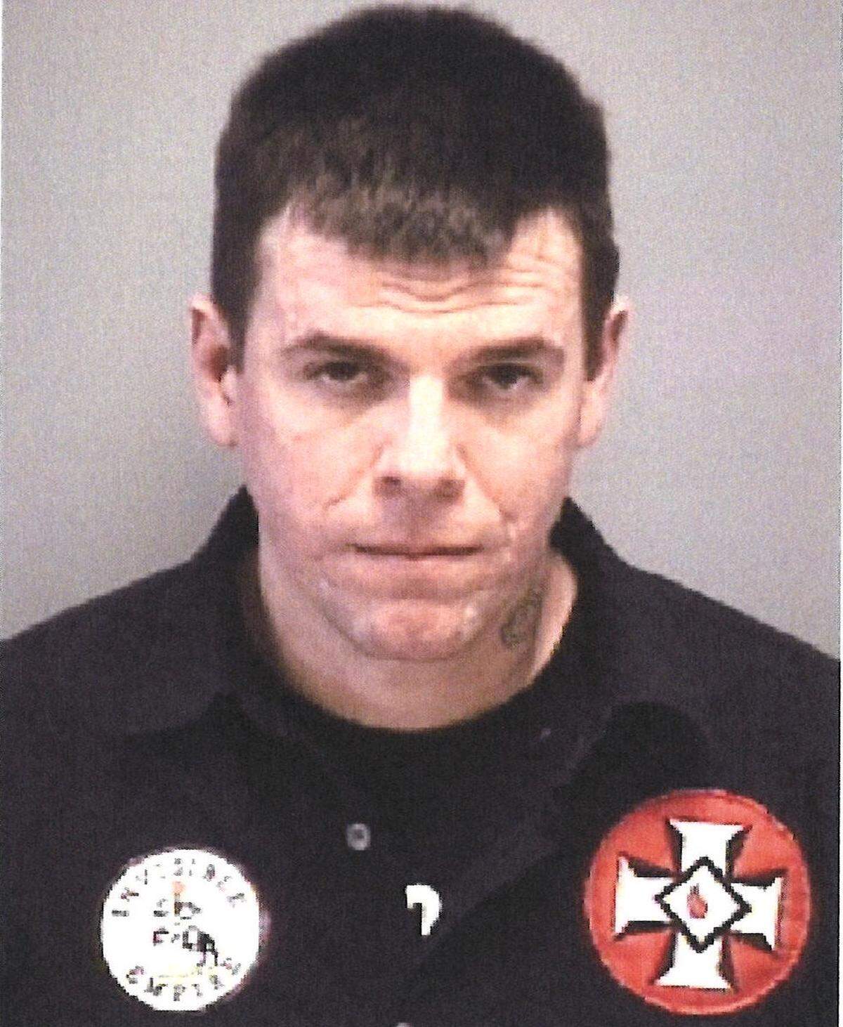 Arrest photo of Loyal White Knights of the KKK member Justin Adams