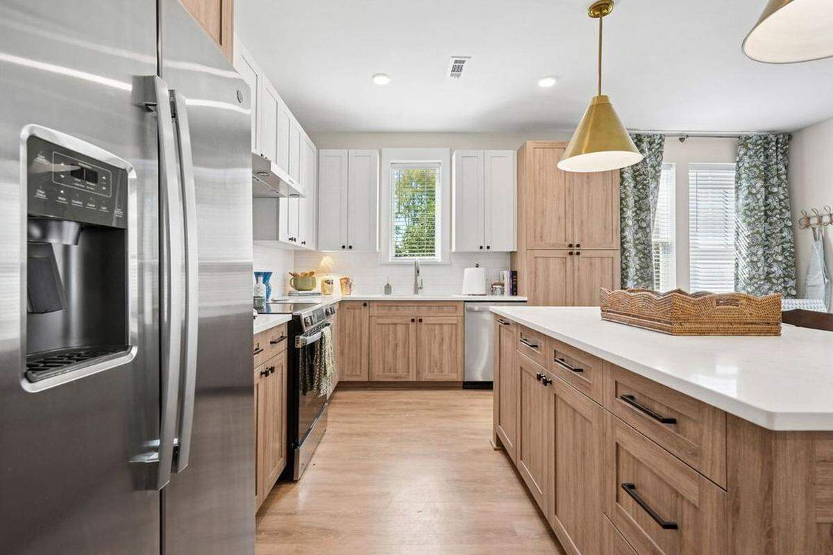 Shown is the kitchen area of an apartment at Novel Davidson.