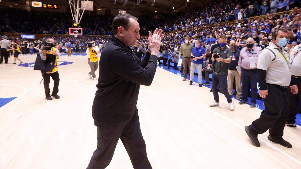 Duke head coach Mike Krzyzewski applauds the crowd as he heads off the court after Duke’s 88-70 victory over Florida State at Cameron Indoor Stadium in Durham on Feb. 19, 2022. Coach K will coach his final game at the arena on March 5.