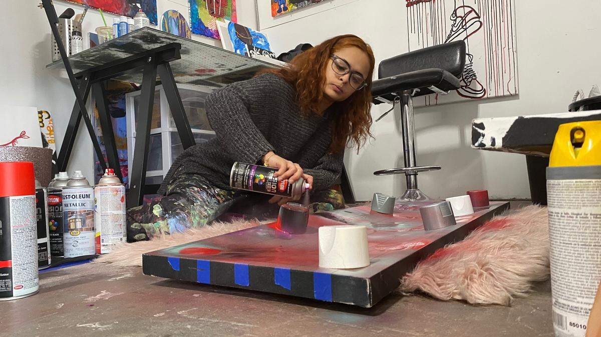 Charlotte artist Arelys Ripoll says she paints her emotions onto her canvases as a way to cope with depression and epilepsy, which she was diagnosed with as a preteen. “When I got into art, it saved me,” she said.