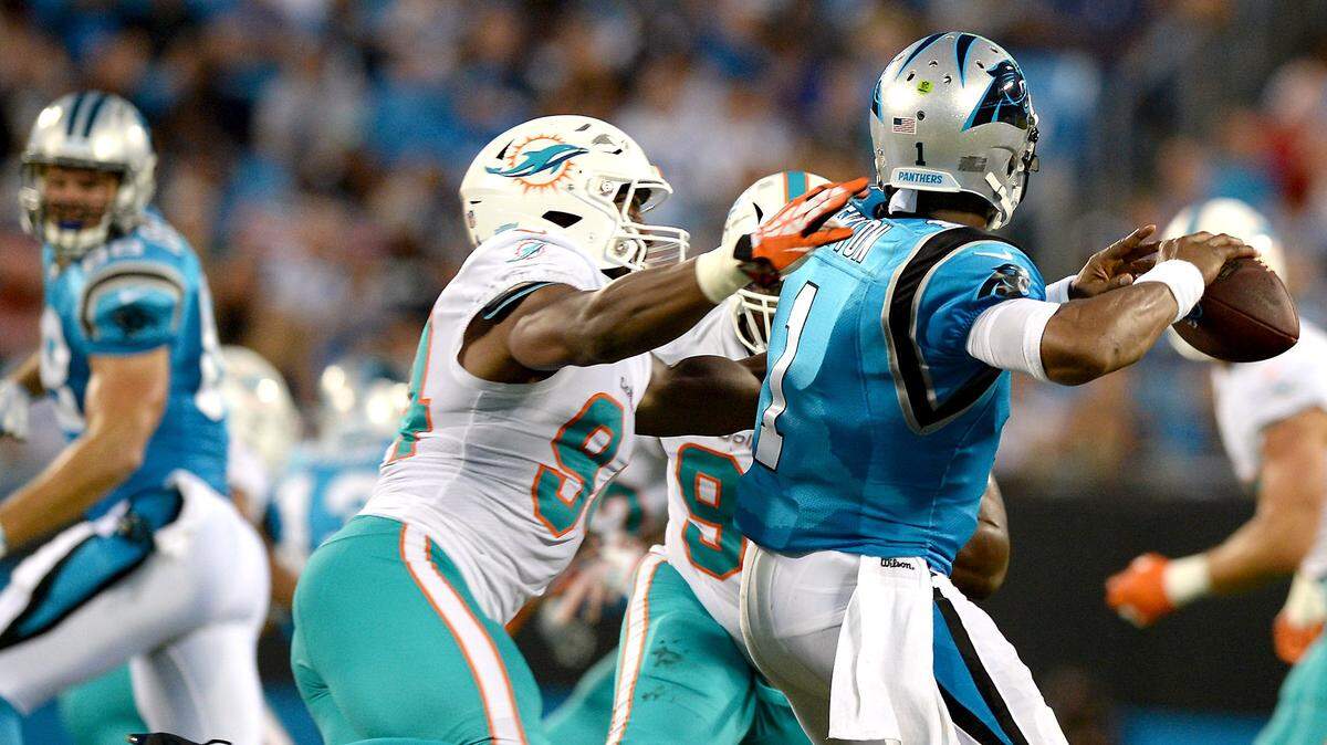 Cam Newton (right) is back and will lead the Carolina Panthers against the Miami Dolphins Sunday in a 1 p.m. game.