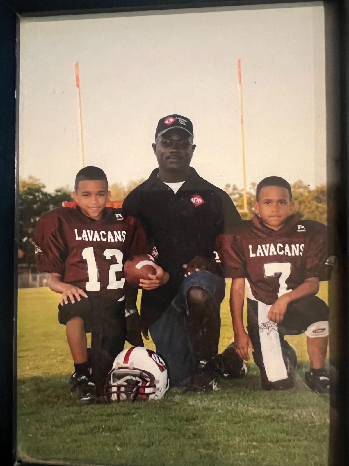 Skip Brooks, center, was a father as well as a youth football coach to his sons: Jordon (left) and Jonathon (right).