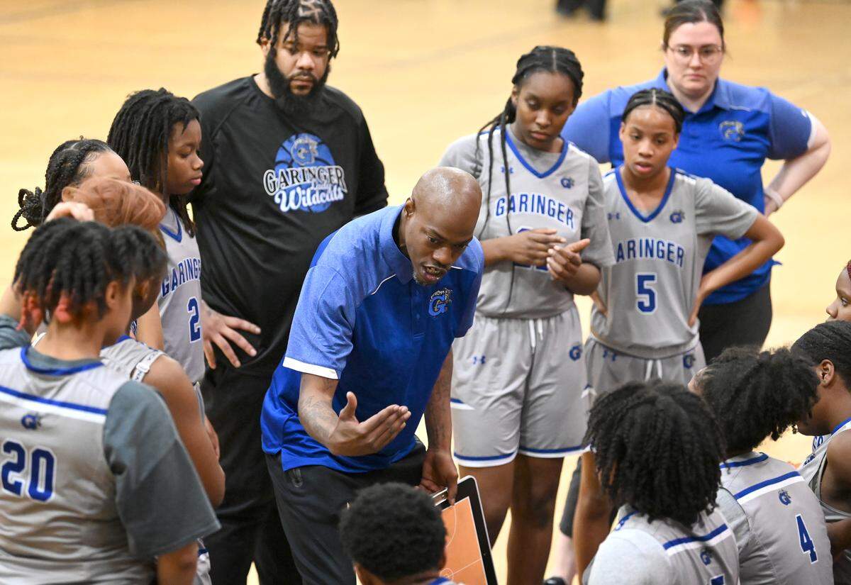Garinger High girls basketball coach Jorvewe Gibson gives instructions to his team during second half action against Providence High on Tuesday, February 7, 2023 at Providence High School.