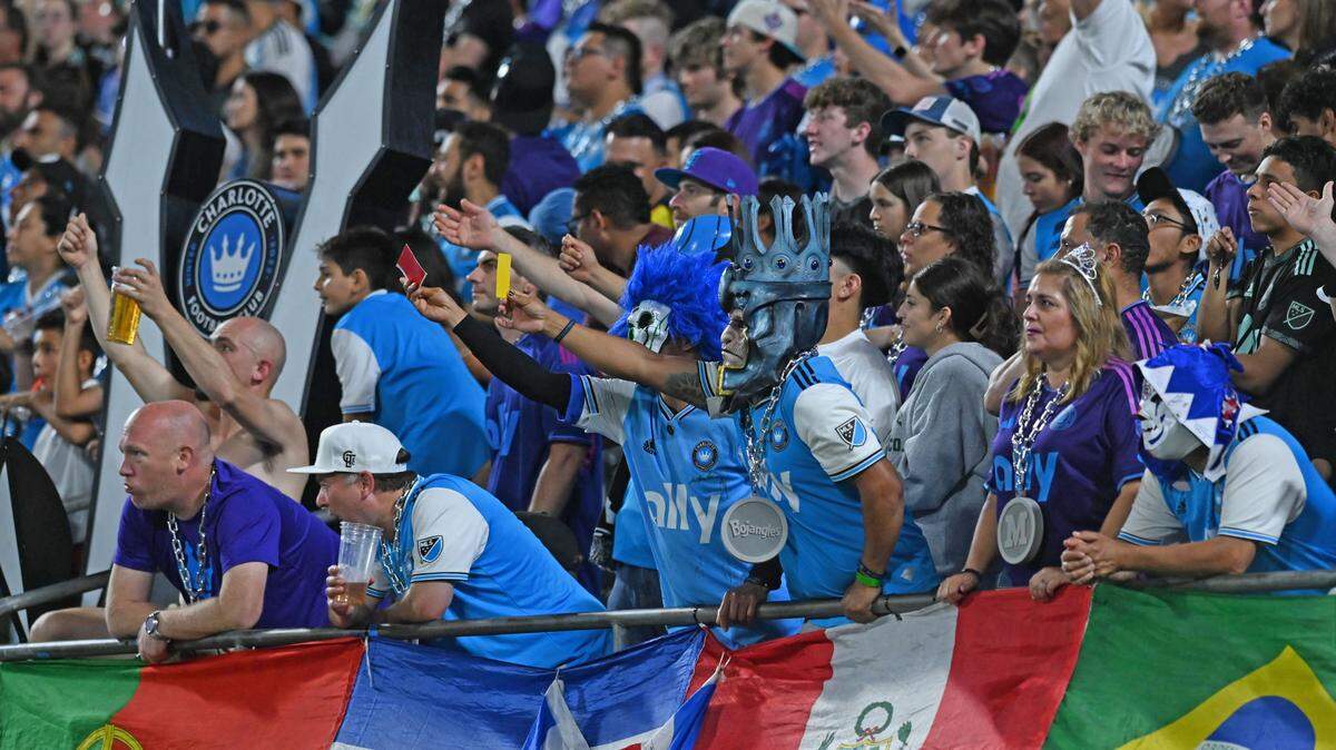 May 20, 2023; Charlotte, North Carolina, USA; Charlotte FC fans hold out penalty cards to the field in the second half against Nashville SC at Bank of America Stadium. Mandatory Credit: Griffin Zetterberg-USA TODAY Sports