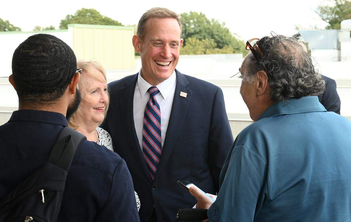 North Carolina candidate for U.S. Senate Ted Budd, center, meets with constituents following the Polaris National Security panel discussion at Skyline Terrace in Charlotte, NC on Monday, October 17, 2022