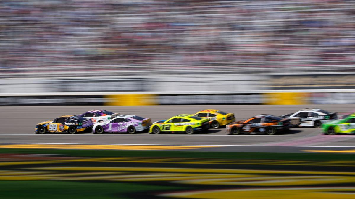 Daniel Suarez (99) leads the race at a restart during a NASCAR Cup Series auto race Sunday, Oct. 16, 2022, in Las Vegas. (AP Photo/John Locher)