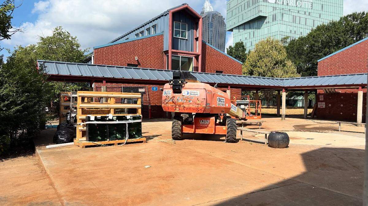 Construction materials sit in front of First Ward Creative Arts Academy in July 2025.