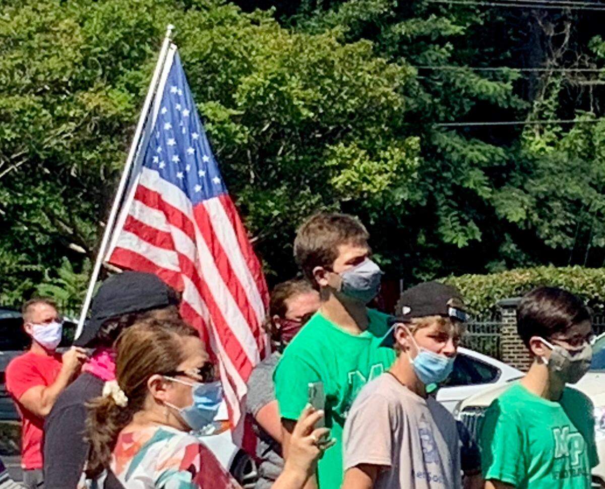 Myers Park quarterback Drake Maye towers over the crowd at a “Save Our Sports” protest Wednesday in Charlotte. About 100 people -- mostly high school student-athletes in danger of losing their sports seasons -- gathered to express their support for having fall sports in Charlotte-Mecklenburg schools in the fall of 2020 even though schoolwork will be almost all online due to the COVID-19 pandemic.