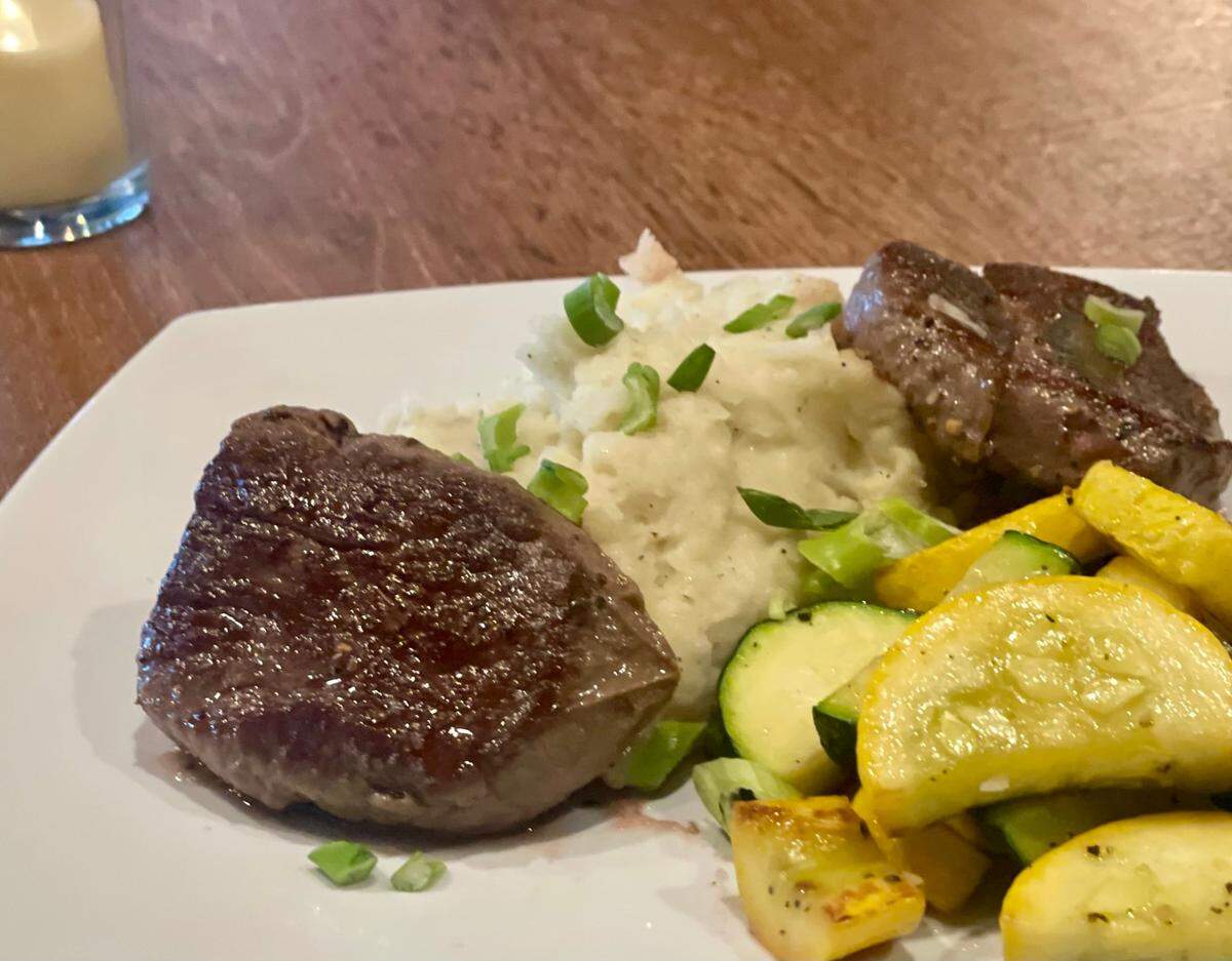 Twin Filet Medallions with garlic mashed potatoes and fresh veggies at Latitudes Bar and Grill in Lake Norman.