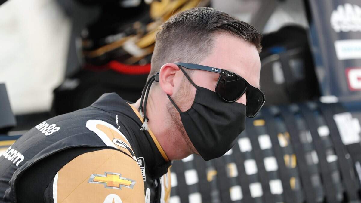 Driver Alex Bowman waits for the start of a NASCAR Cup Series auto race at Charlotte Motor Speedway Thursday, May 28, 2020, in Concord, N.C. (AP Photo/Gerry Broome)