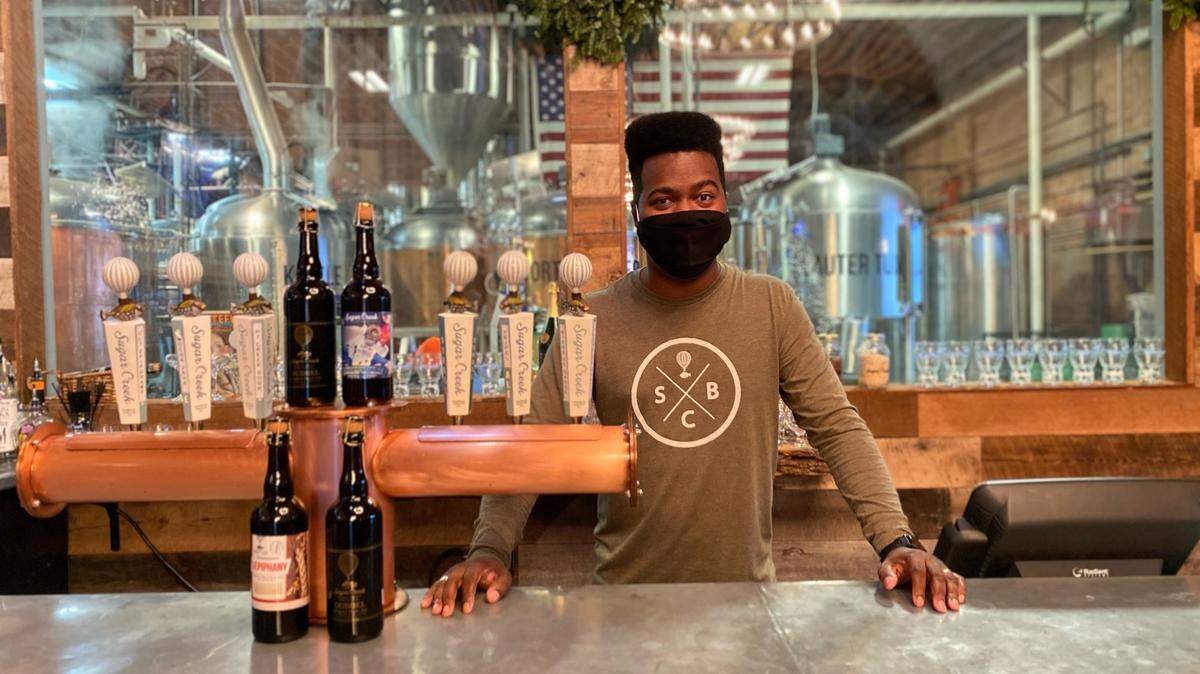 Marques Nash, general manager of Sugar Creek Brewing Company, asks that customers be prepared with their ID ready so lines don’t grow.